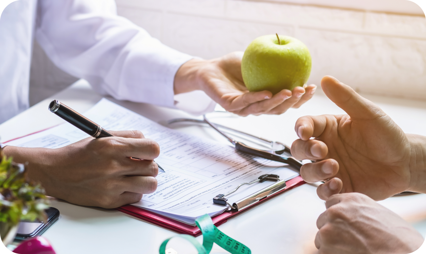 Nutritionist giving consultation to patient with healthy fruit and vegetable