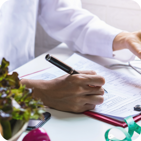Nutritionist giving consultation to patient with healthy fruit and vegetable